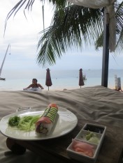 eating sushi on a 4-poster bed on Sairee Beach